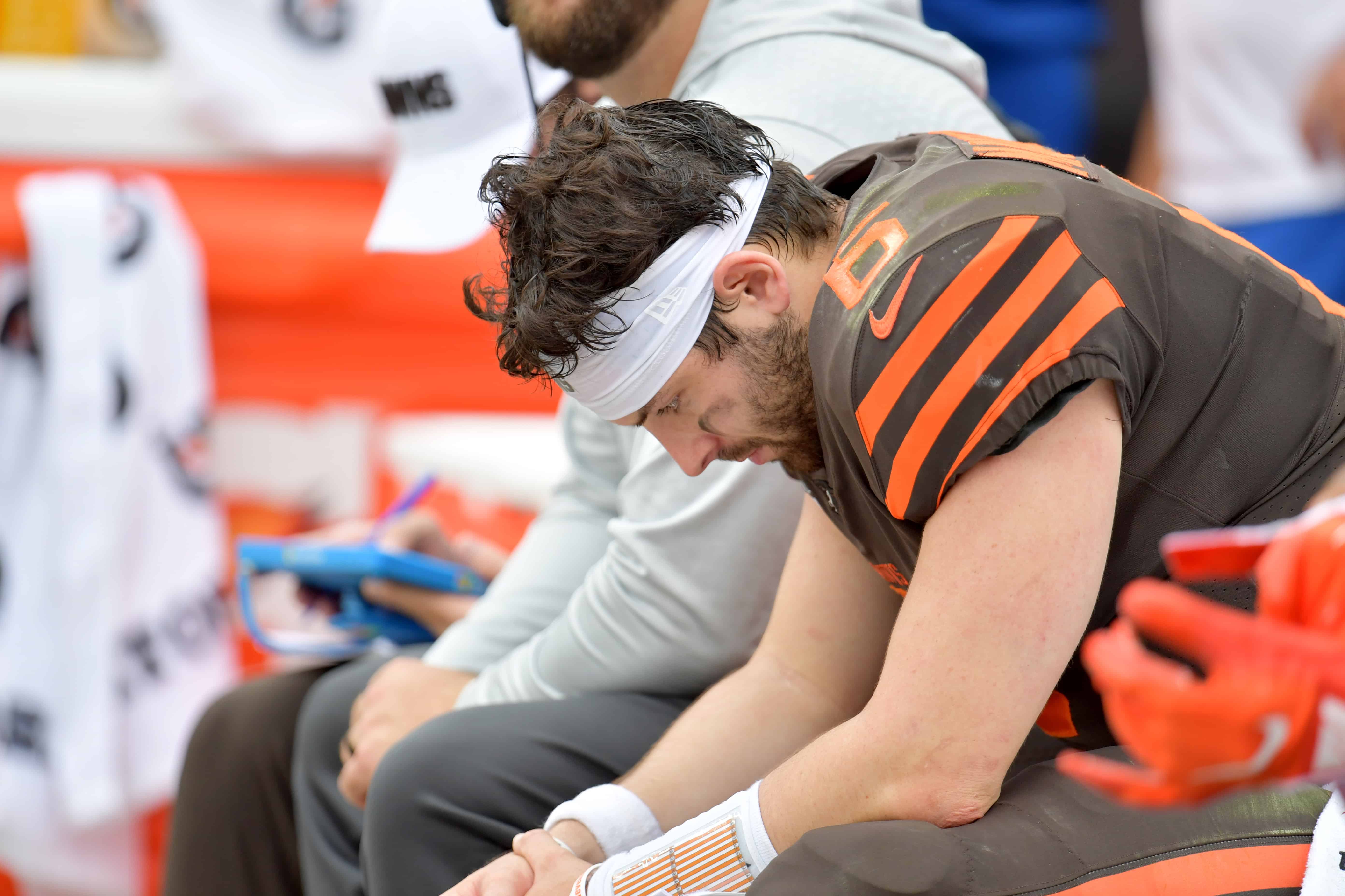 Baker Mayfield sits on the bench