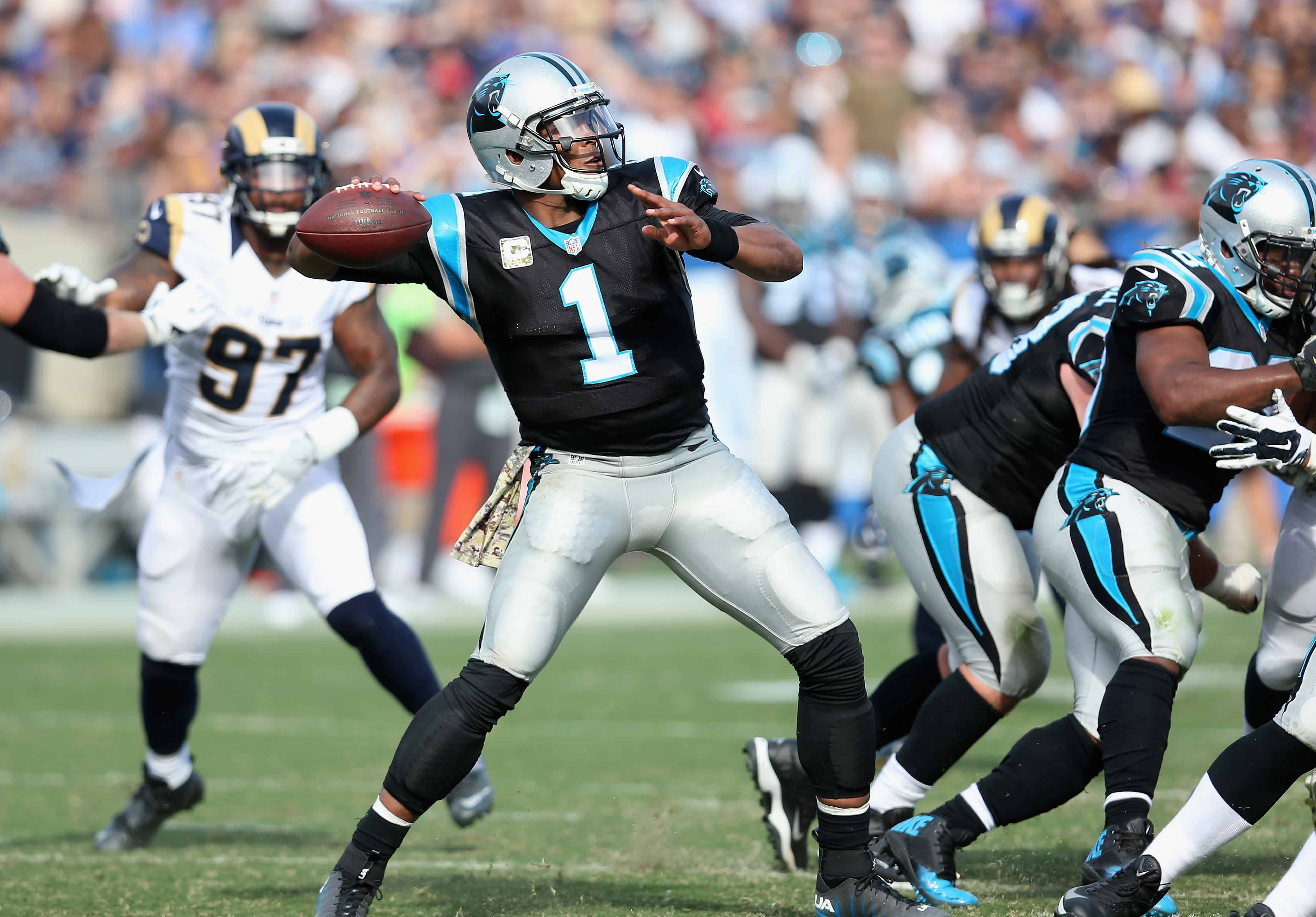 Cam Newton throws pass against Rams