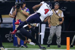 Deshaun Watson dives into the end zone against the Saints