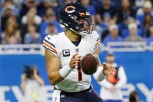 Justin Fields drops back to pass against the Lions.