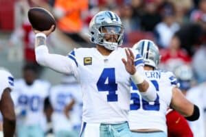 Dak Prescott throws a pass against the 49ers