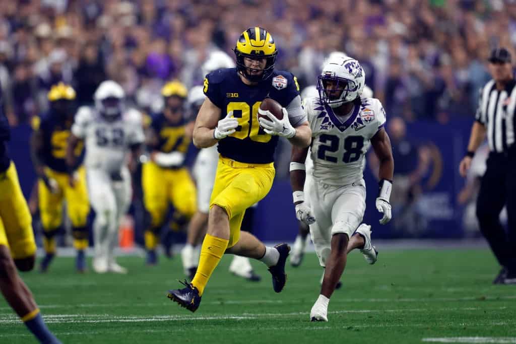Luke Schoonmaker catches pass in college