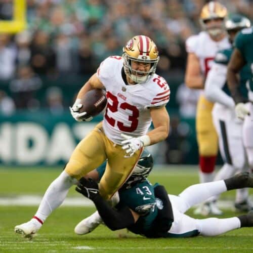 Christian McCaffrey breaks a tackle.