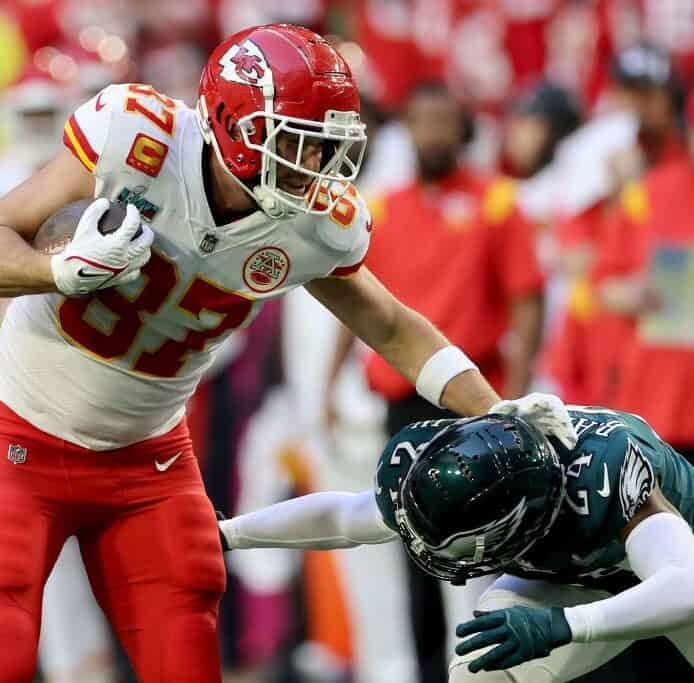 Travis Kelce breaks a tackle in Super Bowl