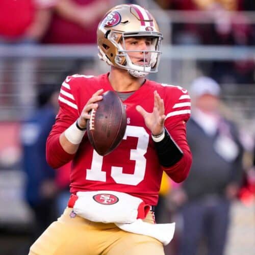 Brock Purdy drops back to pass.