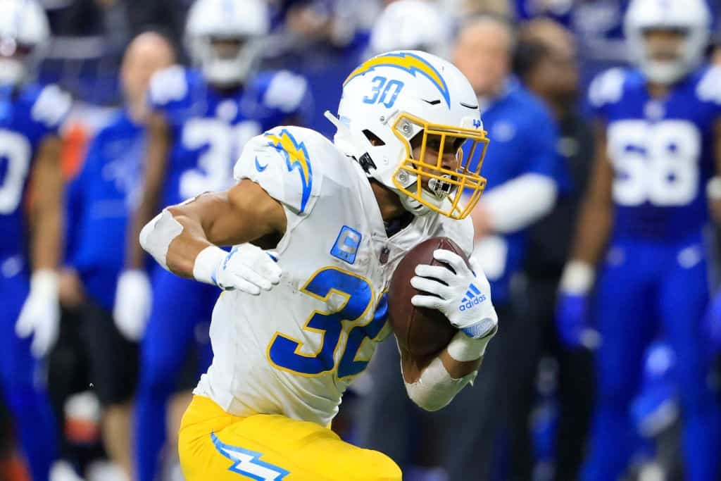 Austin Ekeler carries the football