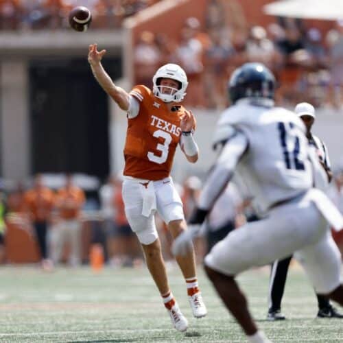 Quinn Ewers throws a pass.