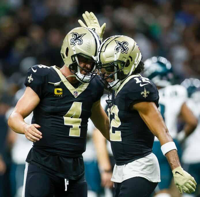 Derek Carr and Chris Olave