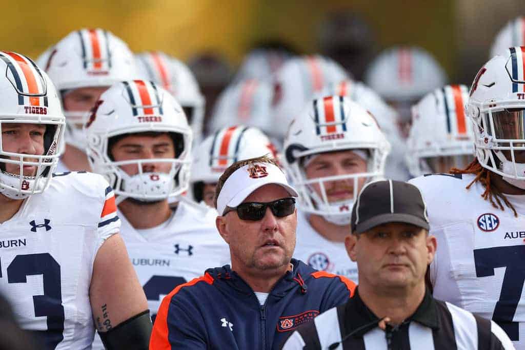 Auburn head coach Hugh Freeze leading his players out of the tunnel