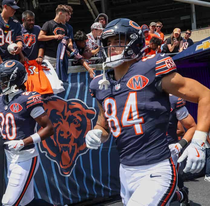 Chicago Bears tight end Colston Loveland runs out onto the field before an NFL preason game