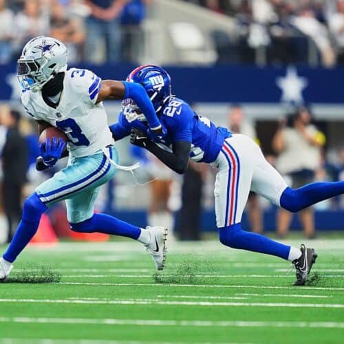 Explosive football action from an NFL game with players in motion on the field.