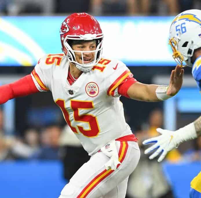 Patrick Mahomes avoids a Chargers defender as he scrambles from the pocket