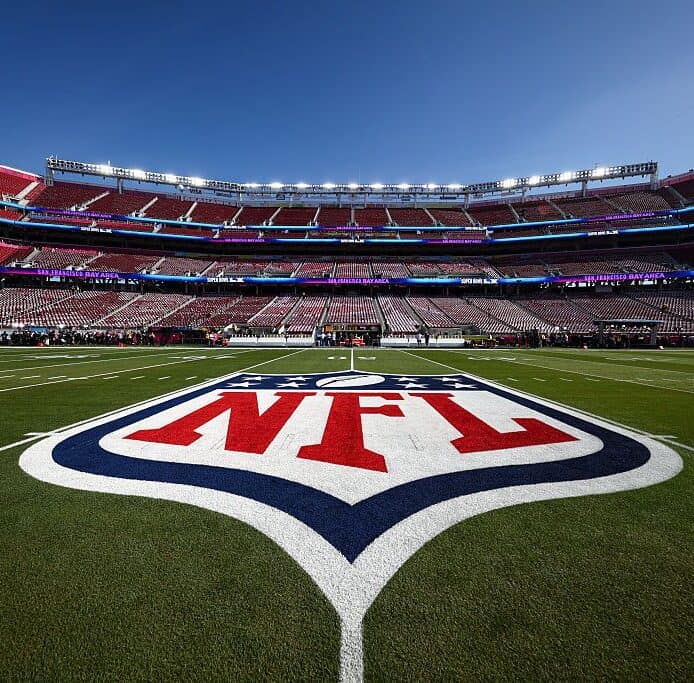 NFL logo at midfield inside an empty stadium ahead of the 2026 NFL schedule release