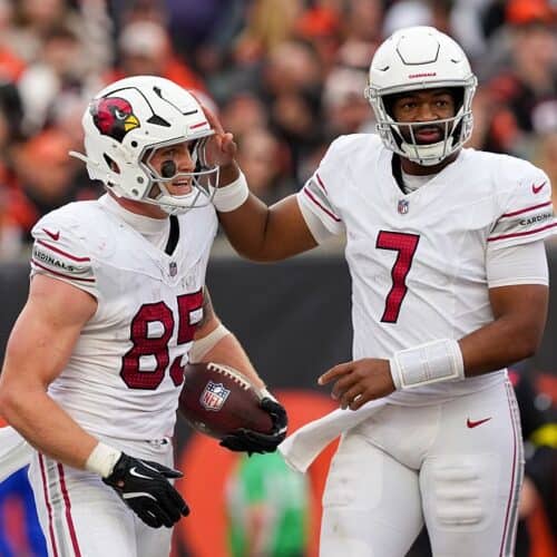 Trey McBride celebrates with Jacoby Brissett