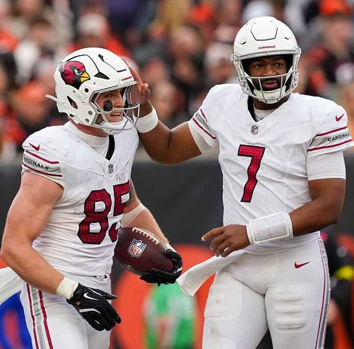 Trey McBride celebrates with Jacoby Brissett